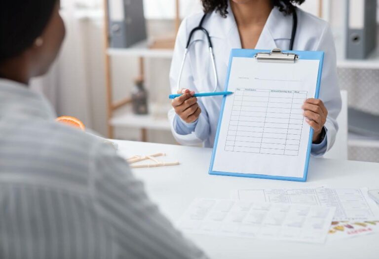 Doctor pointing to clip board. healthcare plannnig vibes